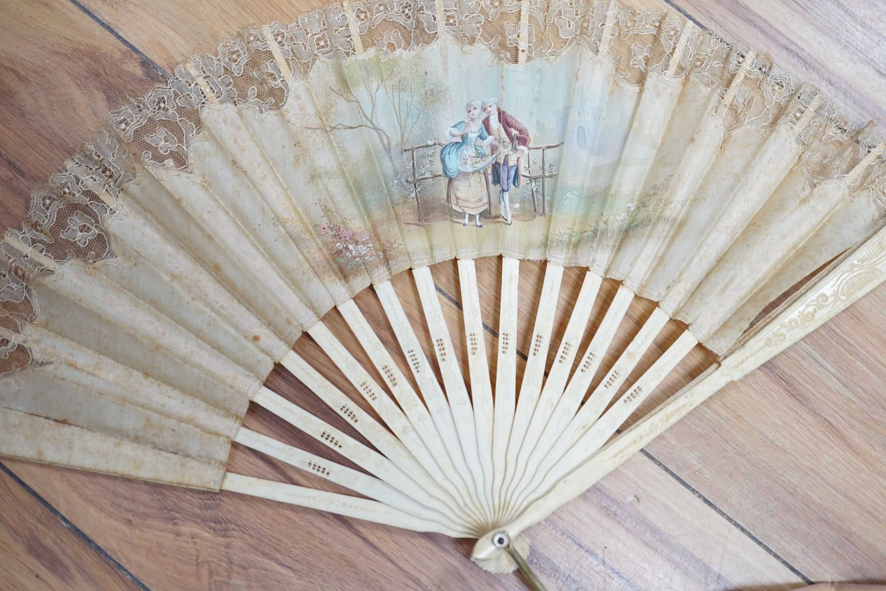 Five various fans, and an 18th century painted leaf fan with ivory chinoiserie decorated guards and sticks, 28 cms high (6)